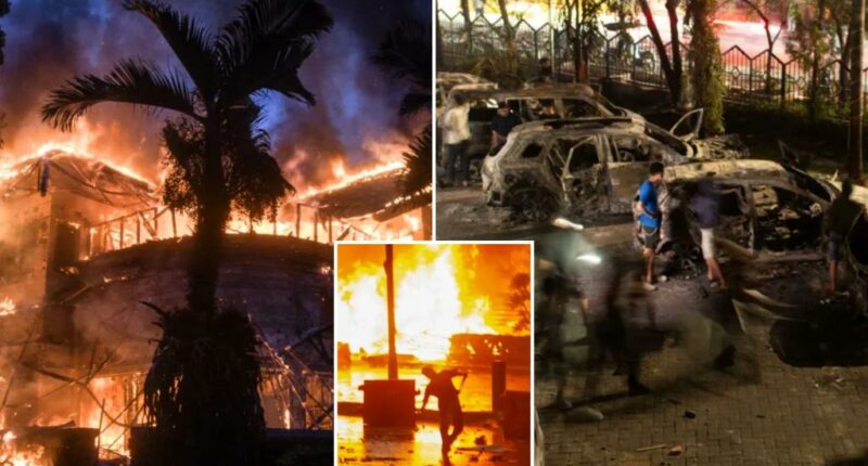 Three dead after mob sets fire to Indonesian regional parliament building