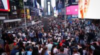 A large crowd of people in Times Square.