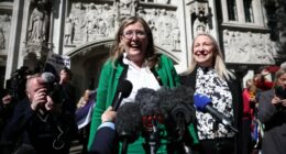 Two women giving a press conference outside the Supreme Court.