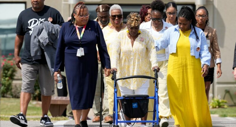 Relatives of victims leaving a maximum security institution after an execution.