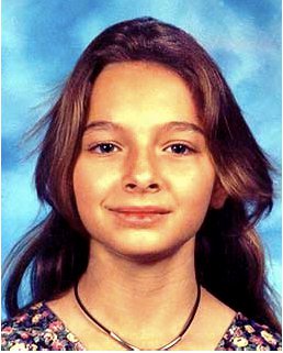 Photo of a young girl with shoulder-length brown hair.