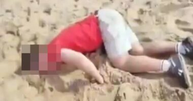 Drugged tourist lying on a beach.