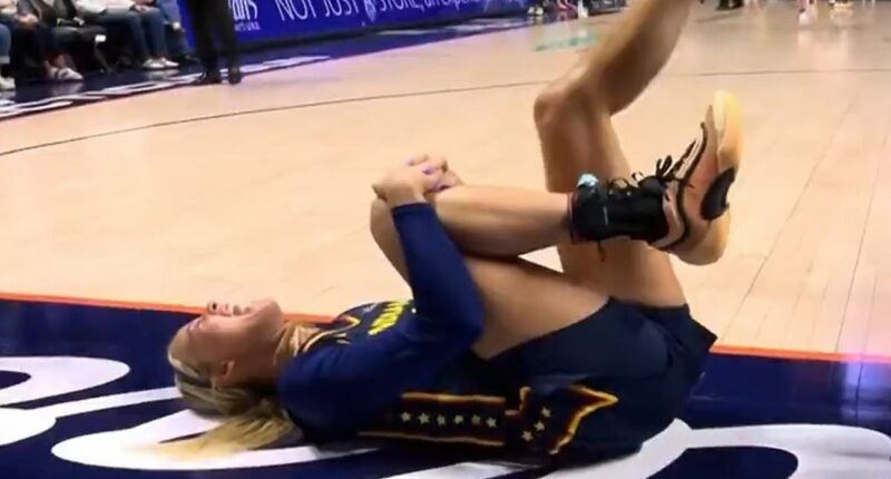 WNBA's Sophie Cunningham screams in pain and is carried off the court