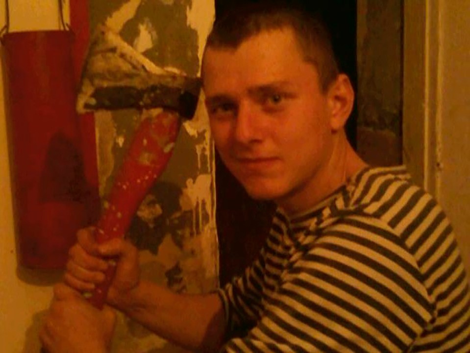 Ruslan Shingirey holding an axe.