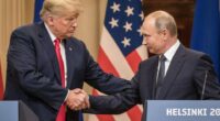 Presidents Trump and Putin shaking hands at a press conference.