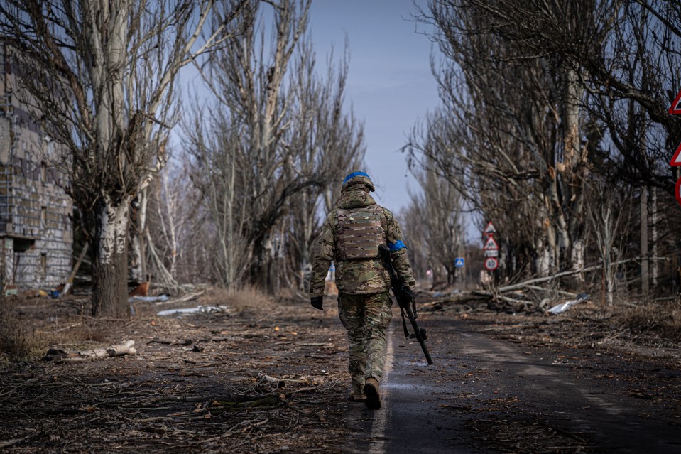 VELYKA NOVOSILKA, DONBAS, UKRAINE - MARCH 7: Ukrainian servicemen of the Ukrainian Volunteer Army patrol around the town of Velyka Novosilka, Ukraine March 7, 2023. The frontline around the city of Vuhledar, a strategic rail and road hub south of Bakhmut, resembles an apocalyptic scenario. Destroyed buildings and burned cars are scattered at both sides of the road. There, hidden on basements of abandoned houses, the Ukrainian Volunteer Army hold their positions against relentless attacks by Russian forces. Under the threat of the enemyâs artillery, that echoes through the village, soldiers hold their fortified positions in shifts of 12h. In recent days, they said, they have been able to repel several Russian offensives. (Photo by Ignacio Marin Fernandez/Anadolu Agency via Getty Images)