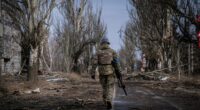 VELYKA NOVOSILKA, DONBAS, UKRAINE - MARCH 7: Ukrainian servicemen of the Ukrainian Volunteer Army patrol around the town of Velyka Novosilka, Ukraine March 7, 2023. The frontline around the city of Vuhledar, a strategic rail and road hub south of Bakhmut, resembles an apocalyptic scenario. Destroyed buildings and burned cars are scattered at both sides of the road. There, hidden on basements of abandoned houses, the Ukrainian Volunteer Army hold their positions against relentless attacks by Russian forces. Under the threat of the enemyâs artillery, that echoes through the village, soldiers hold their fortified positions in shifts of 12h. In recent days, they said, they have been able to repel several Russian offensives. (Photo by Ignacio Marin Fernandez/Anadolu Agency via Getty Images)