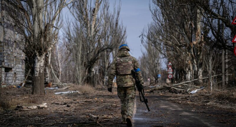 VELYKA NOVOSILKA, DONBAS, UKRAINE - MARCH 7: Ukrainian servicemen of the Ukrainian Volunteer Army patrol around the town of Velyka Novosilka, Ukraine March 7, 2023. The frontline around the city of Vuhledar, a strategic rail and road hub south of Bakhmut, resembles an apocalyptic scenario. Destroyed buildings and burned cars are scattered at both sides of the road. There, hidden on basements of abandoned houses, the Ukrainian Volunteer Army hold their positions against relentless attacks by Russian forces. Under the threat of the enemyâs artillery, that echoes through the village, soldiers hold their fortified positions in shifts of 12h. In recent days, they said, they have been able to repel several Russian offensives. (Photo by Ignacio Marin Fernandez/Anadolu Agency via Getty Images)