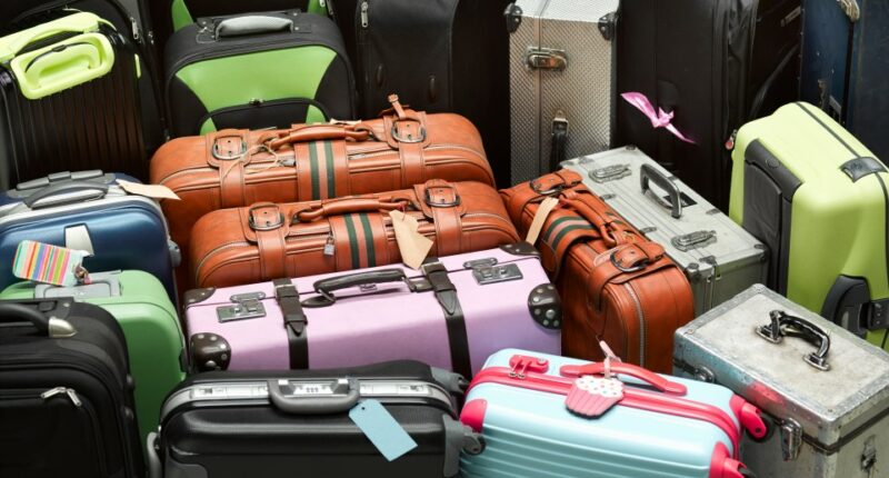 Pile of various suitcases.