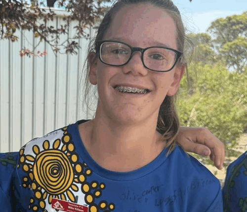 Milla was very artistic and is pictured wearing a Year-6 school shirt that she designed herself.