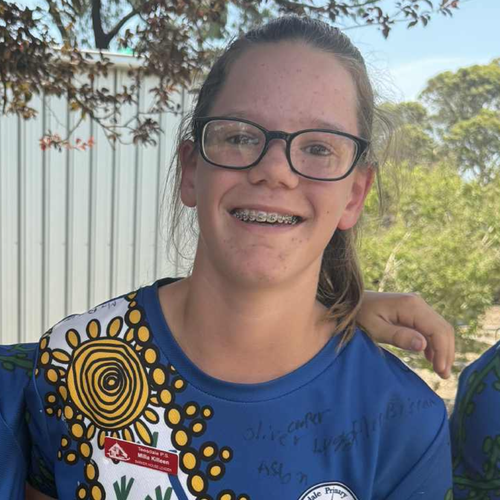 Milla was very artistic and is pictured wearing a Year-6 school shirt that she designed herself.