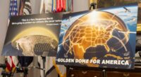Posters for the proposed Golden Dome for America missile defense shield are displayed
