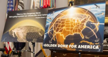 Posters for the proposed Golden Dome for America missile defense shield are displayed