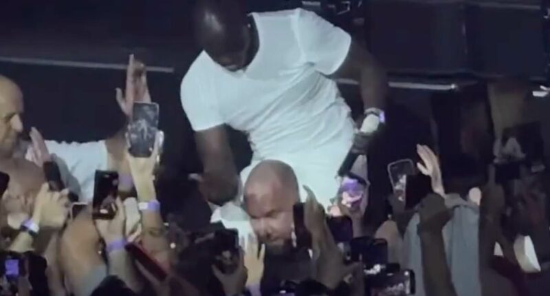 Akon slaps his security guard on the head during a show in Russia