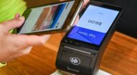 Someone makes a payment using their phone.