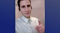 A court handout of Bryan Kohberger taking a selfie with a thumbs up