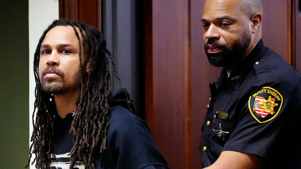 Cincinnati brawl's 'main instigator' is hauled into court for 'knocking woman unconscious' before DANCING and taunting victims