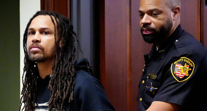 Cincinnati brawl's 'main instigator' is hauled into court for 'knocking woman unconscious' before DANCING and taunting victims