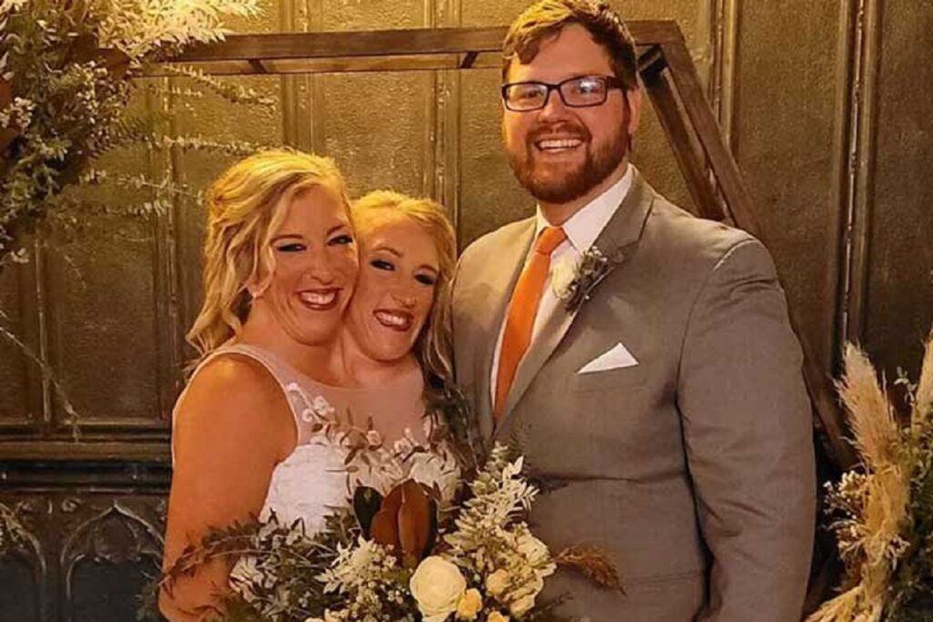 Conjoined twins Abby and Brittany Hensel spotted carrying newborn baby in Minnesota