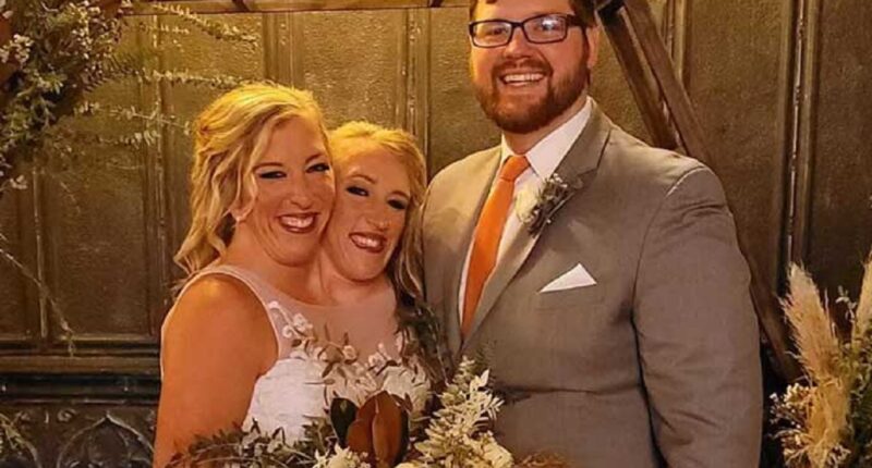 Conjoined twins Abby and Brittany Hensel spotted carrying newborn baby in Minnesota