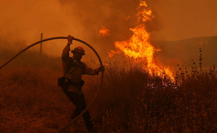 Fast-growing brush fire forces thousands to evacuate north of Los Angeles