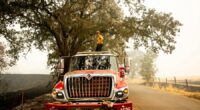 Firefighters try to corral California forest blaze as lightning strikes bring risk of new ignitions