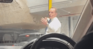 The former Prime Minister saved the day after traffic in a Sydney CBD car park came to a standstill.