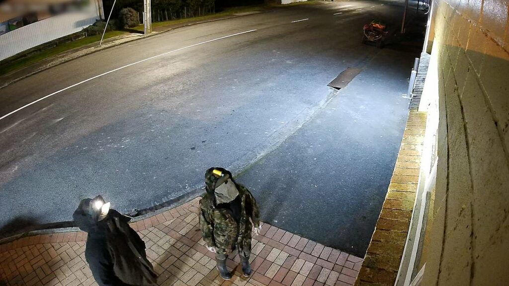 Fugitive father is seen for the first time in 12 months 'breaking into convenience store with one of his three children' four years after going on the run in New Zealand wilderness