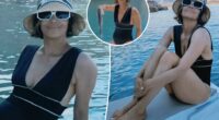 Halle Berry stuns in plunging swimsuit on fishing trip with boyfriend Van Hunt