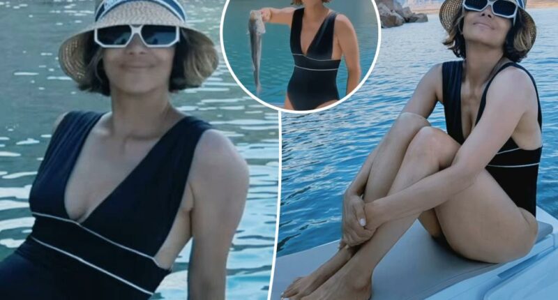 Halle Berry stuns in plunging swimsuit on fishing trip with boyfriend Van Hunt