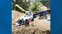 Helicopter team rescues man trapped behind California waterfall