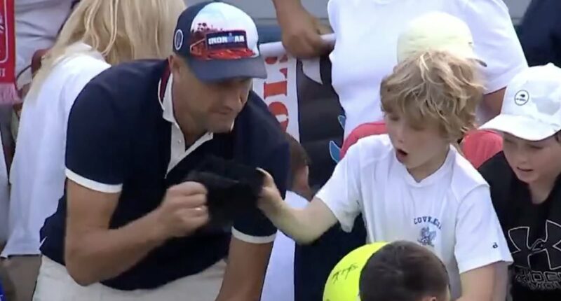 Is this the most hated man on the internet? CEO unmasked after footage of him snatching US Open star's hat out of little boy's hands caused uproar