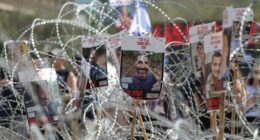 Pictures of Israeli hostages held in Gaza during a demonstration outside the Kirya military headquarters in Tel Aviv, Israel, on August 2