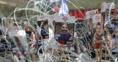Pictures of Israeli hostages held in Gaza during a demonstration outside the Kirya military headquarters in Tel Aviv, Israel, on August 2