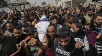 Mourners call to protect journalists after Israel's 'targeted assassination'