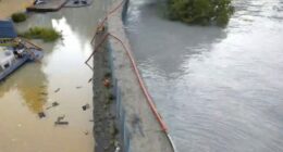 New river barriers prevented severe flood damage from a glacial outburst in Alaska, officials say