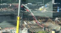 Two men were working on a concrete pumper when the arm failed and they were struck by a large piece of the equipment.
