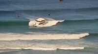 Passenger boat runs aground in high Hawaii surf