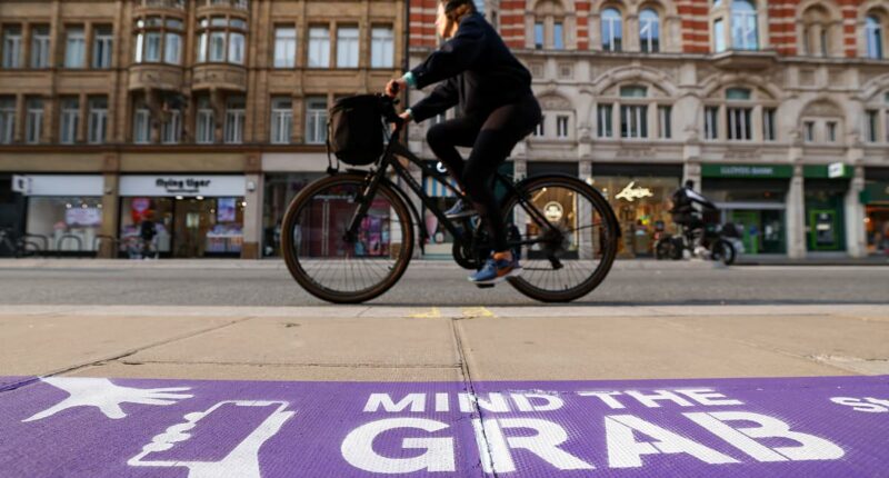 Police praise Oxford Street redesign with huge signs warning of phone thieves as one mobile is stolen every 15 minutes