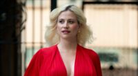 Pregnant Pixie Lott showcases her blossoming baby bump in a plunging red gown as she steps out in London - just weeks before her due date
