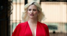 Pregnant Pixie Lott showcases her blossoming baby bump in a plunging red gown as she steps out in London - just weeks before her due date