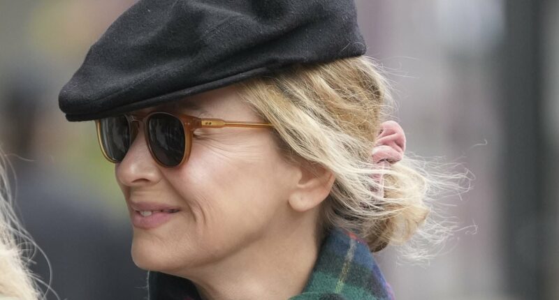 Renee Zellweger cuts a quirky figure in a flat cap and shades