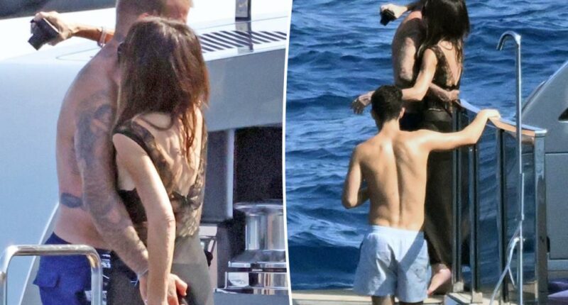 Shirtless David Beckham grabs handful of Victoria’s butt during Italian yacht trip with kids