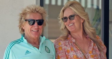 Sir Rod Stewart, 80, and his leggy wife Penny Lancaster, 54, put on a loved-up display as they hold hands during a sunny stroll in Bel Air