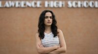 Natasha Torkzaban stands outside Lawrence High School, where she and other students have filed a lawsuit against the school district's use of digital surveillance software, Sunday, Aug. 3, 2025, in Lawrence, Kan. (AP Photo/Charlie Riedel)