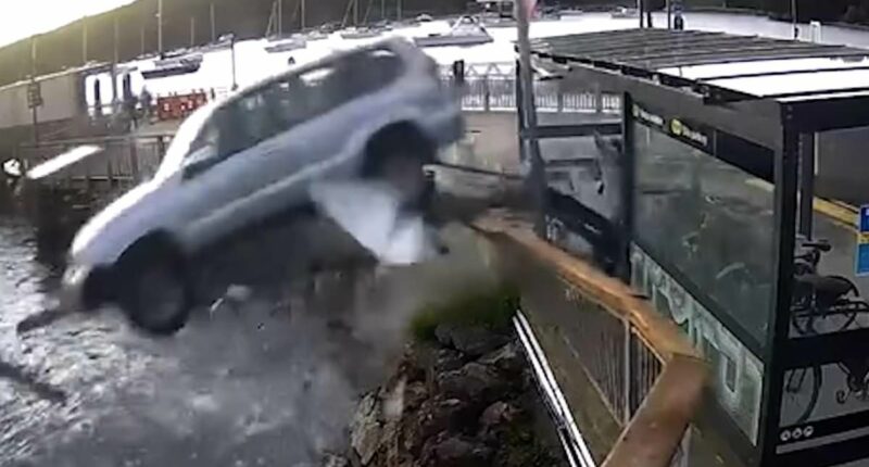 Terrifying moment drunk pensioner drives SUV off wharf and crashes into the sea before dramatic rescue from sinking car