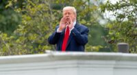 Trump appears on White House roof, shouts answers to reporter questions