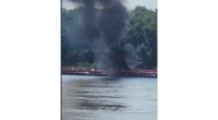 Two die when helicopter crashes into a barge in the Mississippi River