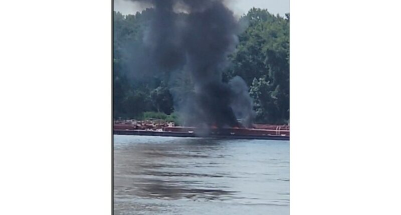 Two die when helicopter crashes into a barge in the Mississippi River