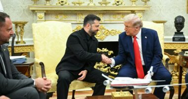 Ukrainian President Volodymyr Zelensky and US President Donald Trump shake hands during a meeting in the Oval Office of the White House in Washington, DC, on August 18, 2025. European leaders join Ukrainian President Volodymyr Zelensky in talks with US President Donald Trump on August 18, as they try to find a way to end Russia's offensive. The leaders heading to Washington on Monday to appear alongside Zelensky call themselves the "coalition of the willing." (Photo by Mandel NGAN / AFP) (Photo by MANDEL NGAN/AFP via Getty Images)